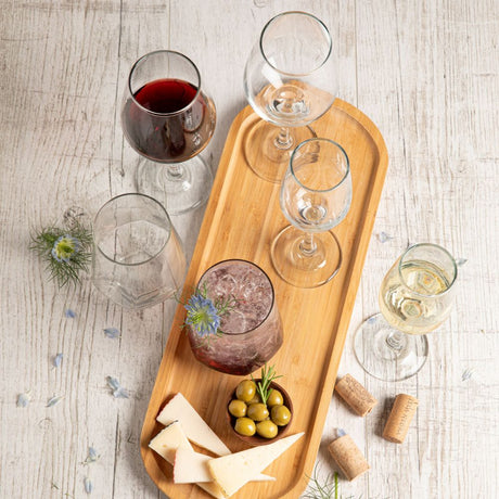 Copas y vasos de vidrio llenos, colección Tu Mesa, set brunello