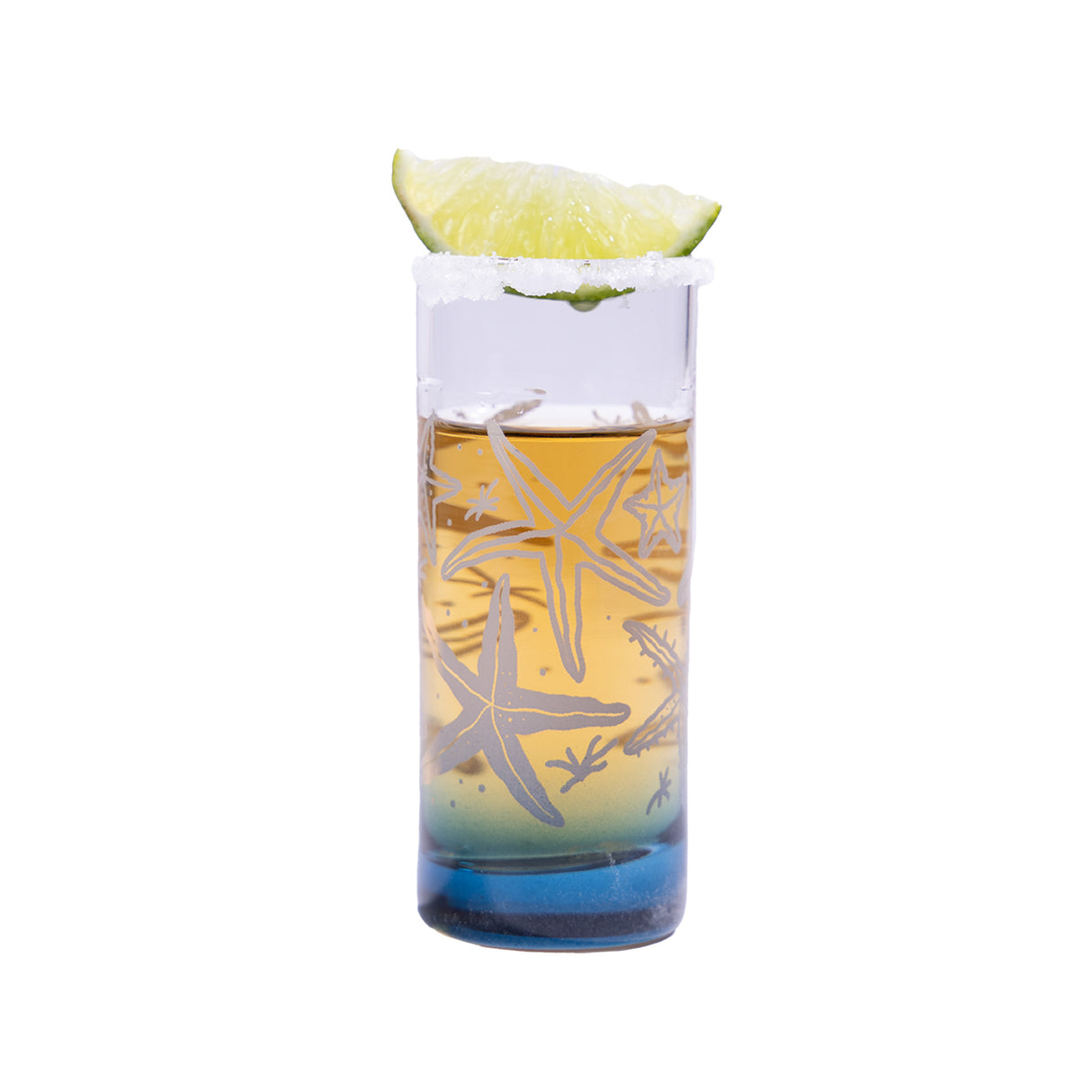 Vaso de vidrio para shots de la colección corales, servido con limón